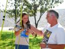 All ages are welcome at the regular ARDF practice and antenna-assembling sessions in Southern California. David White, WD6DRI, is shown here helping his daughter Kelsey learn how to use the measuring-tape Yagi that she just finished building. [Joe Moell, K0OV, Photo]