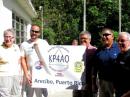 (L-R) ARRL President Kay Craigie, N3KN; Southeastern Division Assistant Director José “Otis” Vicéns, NP4G; José “Coki”,Montijo, WP4OV, of the Caribbean Amateur Radio Group; Ángel Vázquez, WP3R, Director of Operations of the Arecibo Observatory and President of the KP4AO Amateur Radio Club, and Dennis Motschenbacher, K7BV, of Yaesu, flank the new KP4AO banner.