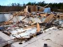 Much of the bathhouse at the Fordyce County Club was damaged by the EF2 tornado and blown into the pool. [Photo courtesy of the Little Rock NWS office]