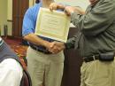 One of the highlights of an ARRL Board Meeting is the recognition of newly elected Director and Vice Directors. In this photo, Delta Division Director David Norris, K5UZ (left) presents a certificate and pin to new Delta Division Vice Director Glen Clayton, W4BDB. [Harold Kramer, WJ1B, Photo]