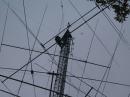 Andrew Toth installs the new 160 meter dipole during W1AW's semi-annual antenna inspection. [S. Khrystyne Keane, K1SFA, photo]