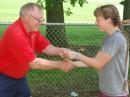 Collecting one of her gold medals from Dick Arnett, WB4SUV, is Lori Huberman of Cambridge, Massachusetts. This is Lori’s second year of competition in the USA championships. [Joe Moell, K0OV, photo]