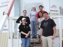 MDRS Crew 69 poses for a group picture in front of the Hab, their desert home of two weeks. LeftRight: Andrea Hartlage, KG4IUM; Elisha Sanders, KJ4CQM; Emily Colvin, KI4MSM; Sean Blackman, KJ4CRD; Tulika Raj, KJ4CKX, and Dan Crowley, KJ4CQI. [Photo courtesy of Andrea Hartlage, KG4IUM]