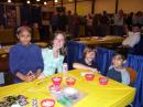 Several youth pose for a quick picture while working on their projects in the RARSfest Youth Lounge. [Andrea Hartlage, KG4IUM, Photo]