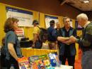 ARRL Education Services Manager Debra Johnson, K1DMJ, and ARRL Education Project Coordinator Mark Spencer, WA8SME, tell a Hamvention visitor all about the ARRL Teachers Institute. [S. Khrystyne Keane, K1SFA, Photo]