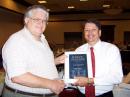 ARRL President Joel Harrison, W5ZN, presents New England Division Director Tom Frenaye, K1KI, with his DXCC Challenge plaque. 