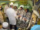 Garriott (left), Lonchakov (center) and Fincke listen to a briefing during a day of fit checks and rehearsals at the site of their launch into space from the Baikonur launch complex in Kazakhstan. [Victor Zelentsov, NASA, Photo] 