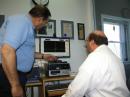 Basilotto shows ARRL Membership and Volunteer Programs Assistant Manager Norm Fusaro, W3IZ, how to operate the FLEX 5000A. [S. Khrystyne Keane, K1SFA, Photo]