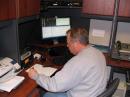 Bill Yaremchuk, KE7SFP, receives traffic at the Tillamook County Sheriff's Office Command Center [Gordon McCraw, WX7EM, Photo]